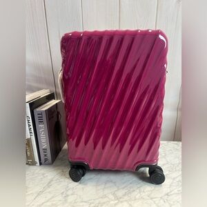 Tumi Pink Rolling Suitcase